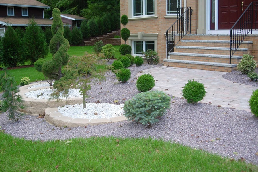 Planted trees, crushed stone, and stone wall project in Weston, MA