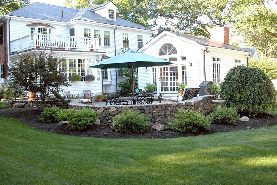 Landscaped yard, stone patio and wall project in Weston, MA